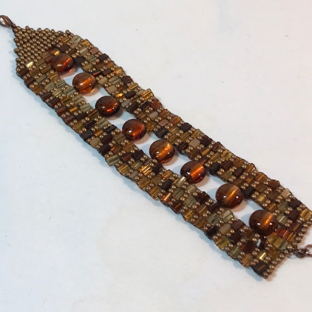 Beaded flat bracelet, 10 in length, brown color beads of various shades